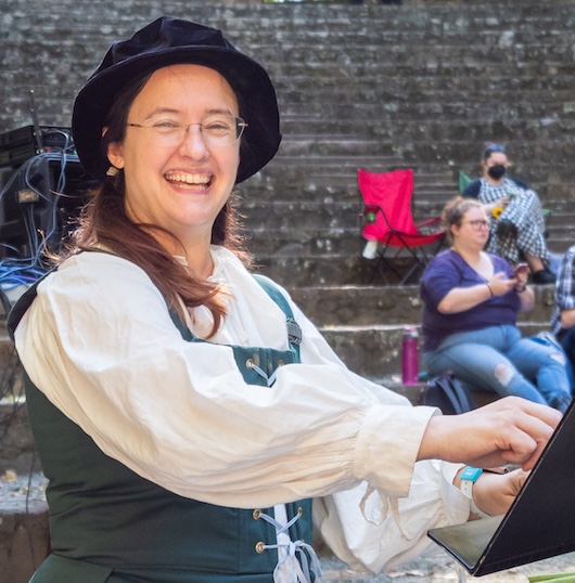 A picture of Joanna Sisk-Purvis conducting a show.