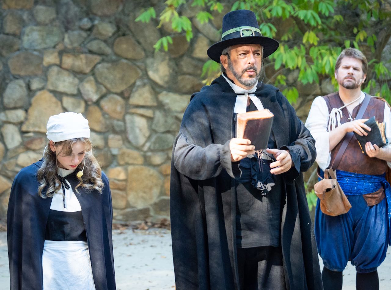 Brother Jeremiah and Portia preaching to Nigel and the crowd